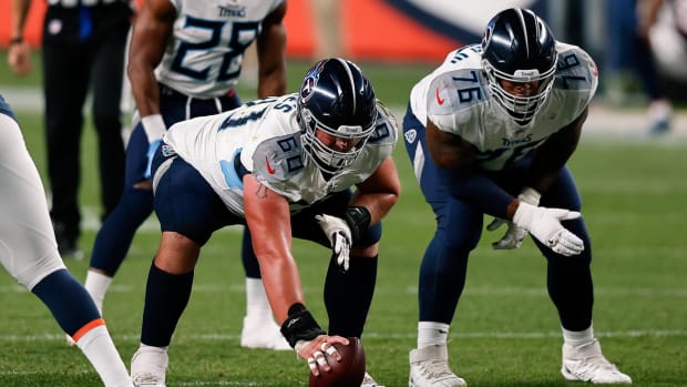 Tennessee Titans center Ben Jones (60) and offensive guard Rodger Saffold (76) in the first quarter against the Denver Broncos at Empower Field at Mile High.